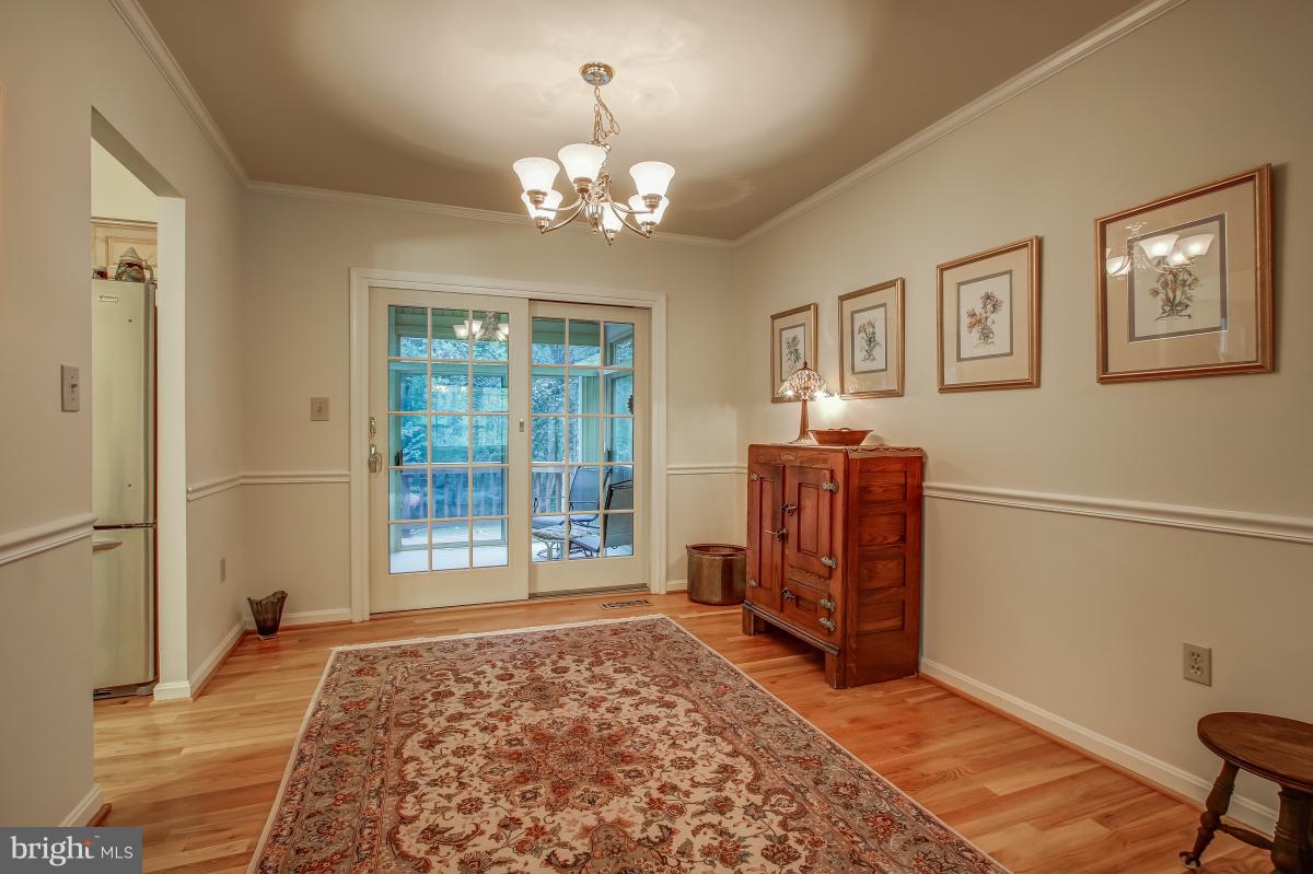 1814 Cranberry Lane Reston, VA 20191 - Photo 7 of 30 a spacious bedroom with a bed and wooden floor