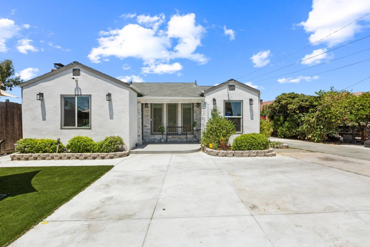 a front view of a house with a yard