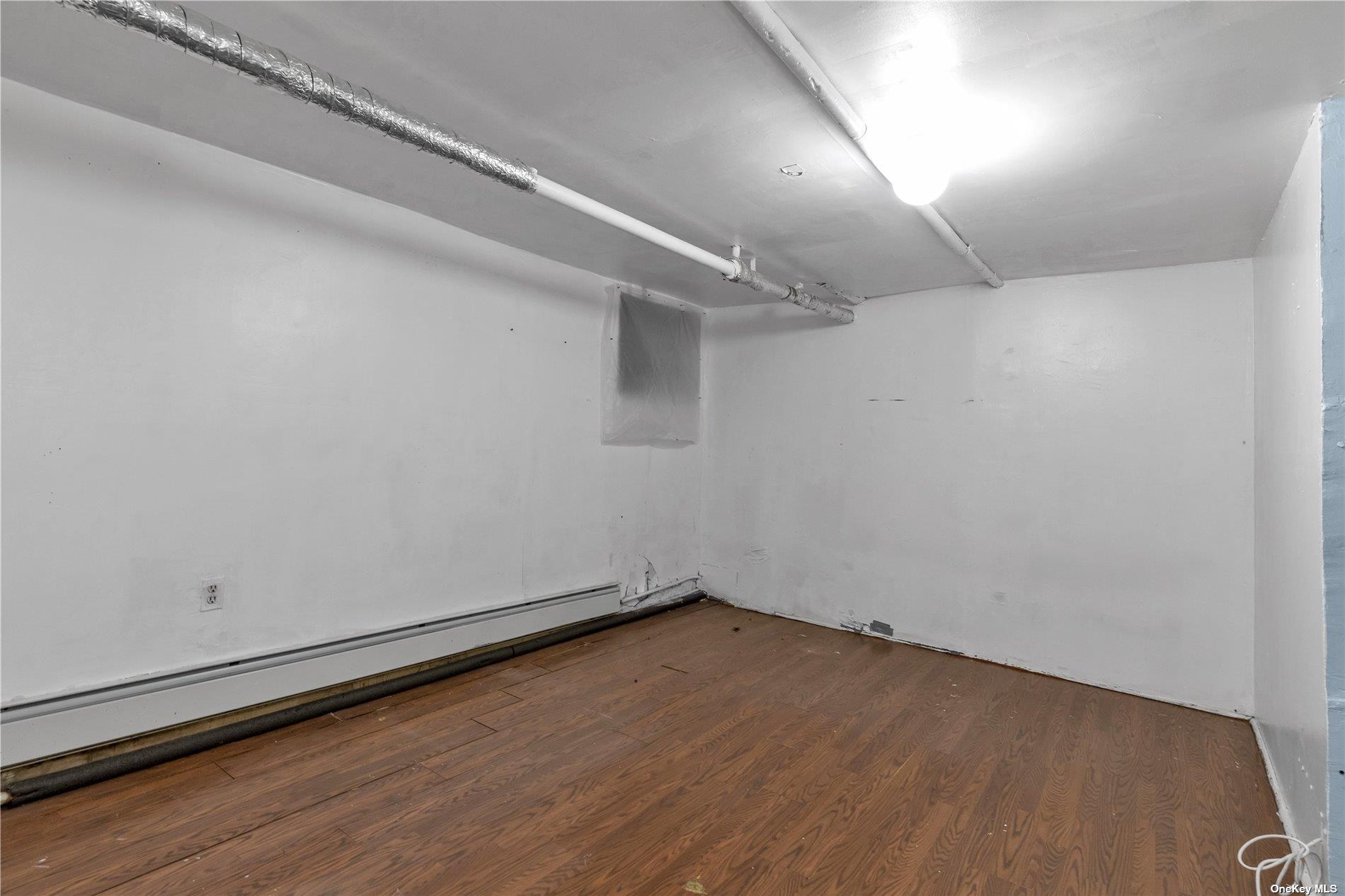 111-24 Northern Boulevard Queens, NY 11368 - Photo 24 of 29 a view of a room with wooden floor