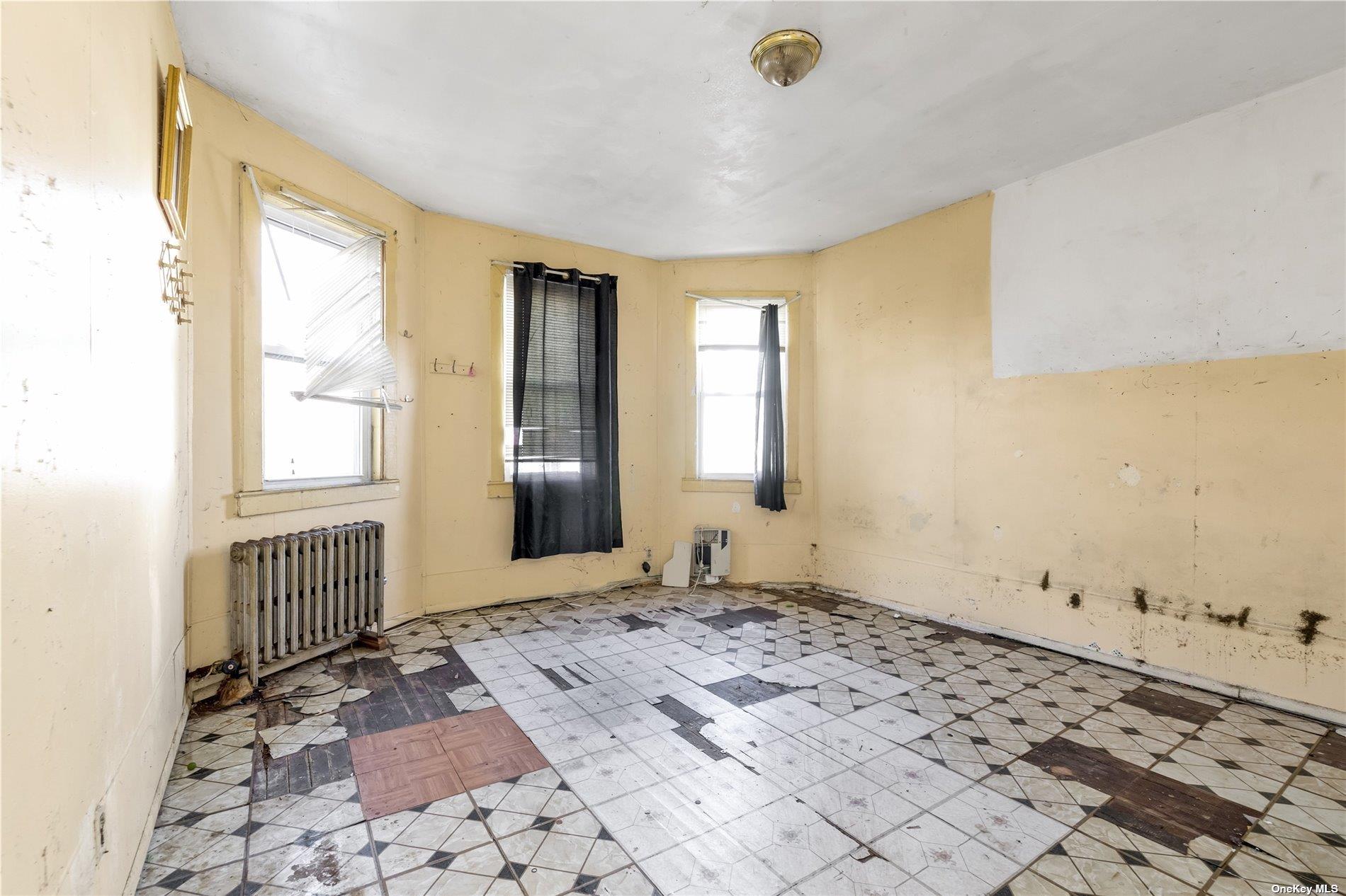 111-24 Northern Boulevard Queens, NY 11368 - Photo 10 of 29 a view of an empty room and window