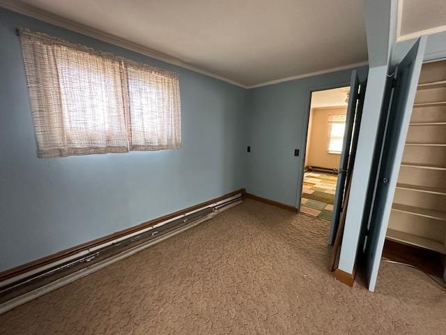 412 Monroe Street Eveleth, MN 55734 - Photo 11 of 22 Unfurnished bedroom featuring carpet, a closet, and ornamental molding