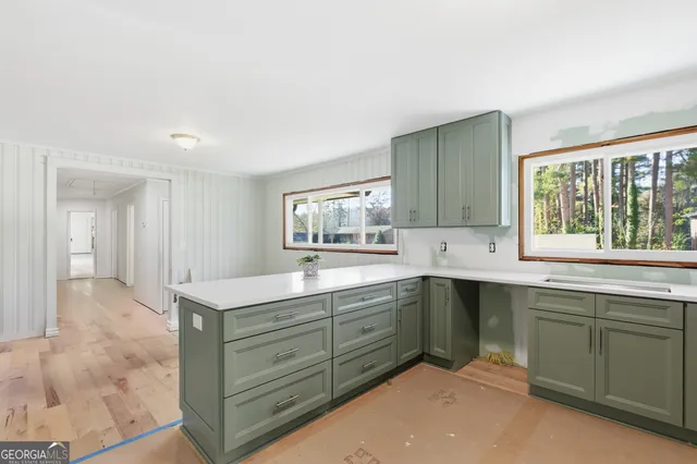 a kitchen with a sink and cabinets
