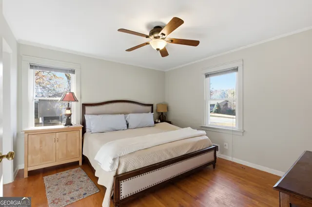a bedroom with a large bed and a window