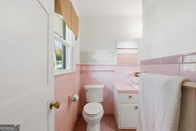 a bathroom with a sink and toilet