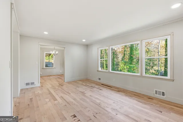 a view of an empty room with a window