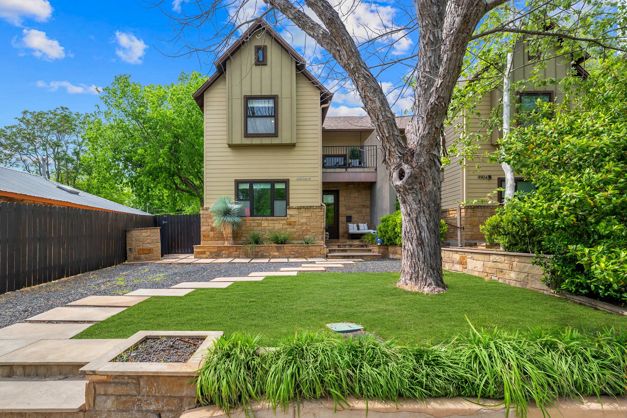 4904 Duval Street, Unit A Austin, TX 78751 - Photo 1 of 39 a front view of a house with a yard and trees
