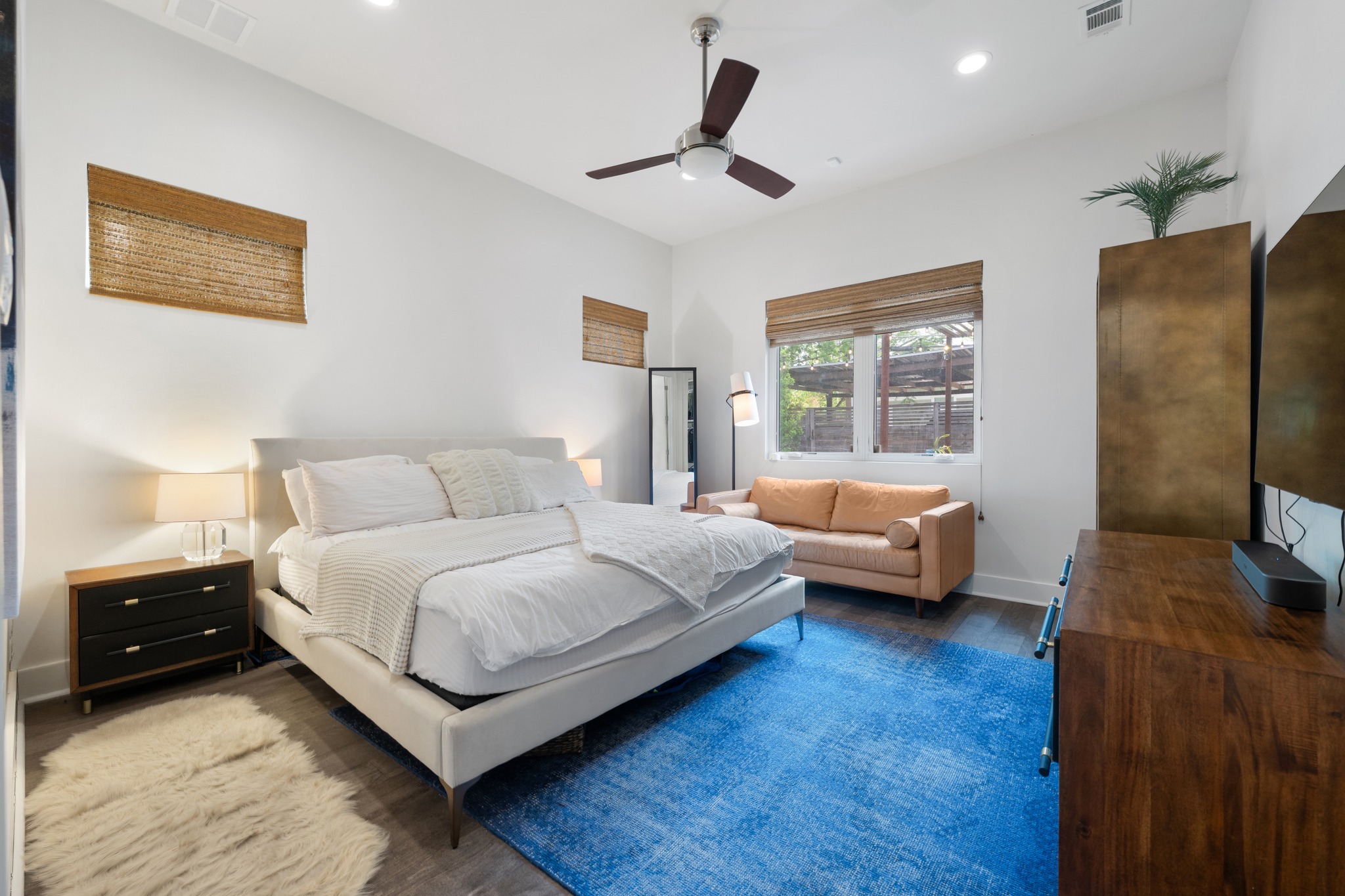 4904 Duval Street, Unit A Austin, TX 78751 - Photo 16 of 39 a bedroom with a bed couch and a window