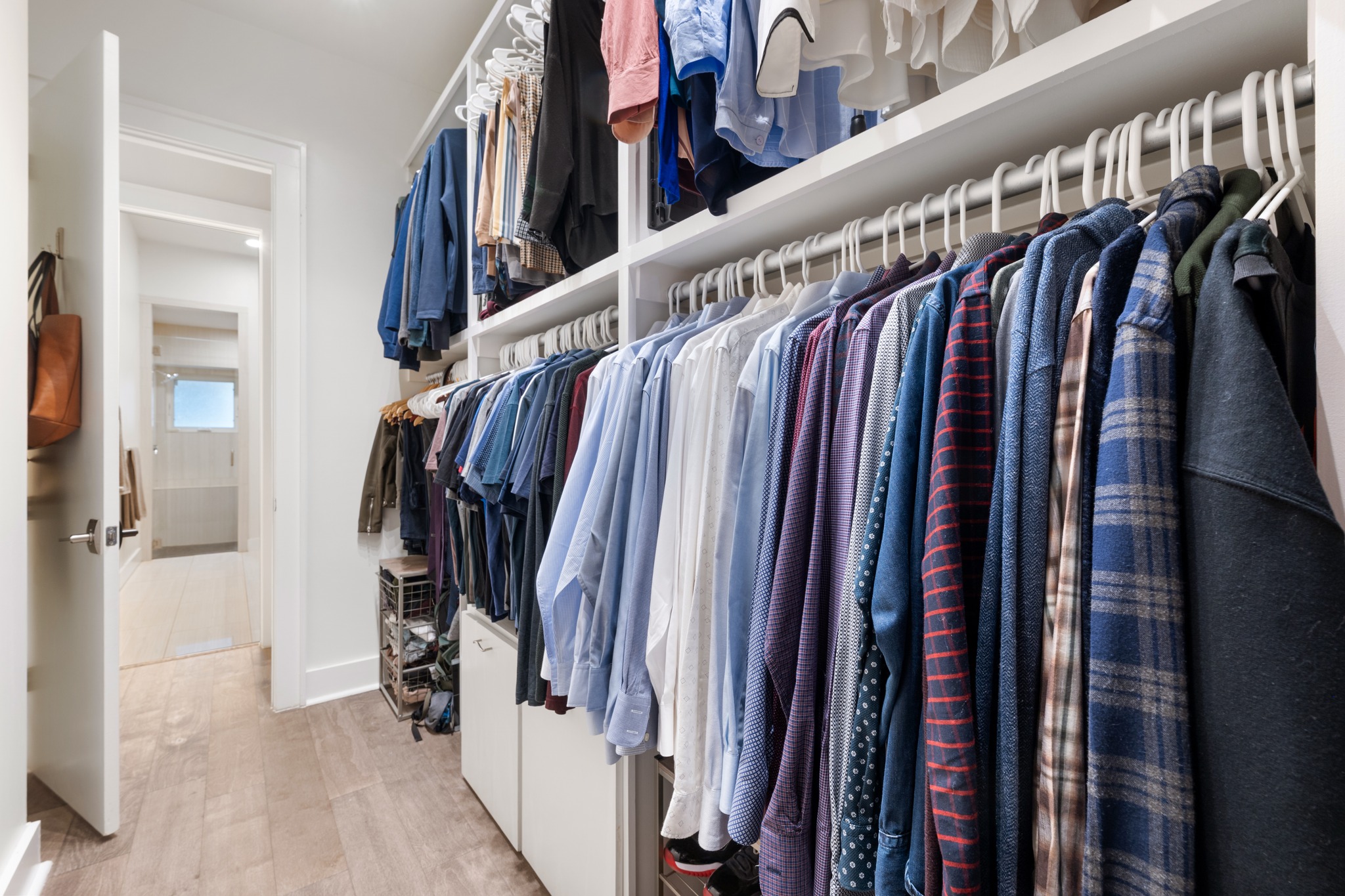 4904 Duval Street, Unit A Austin, TX 78751 - Photo 20 of 39 a view of walk in closet with clothes and shoes