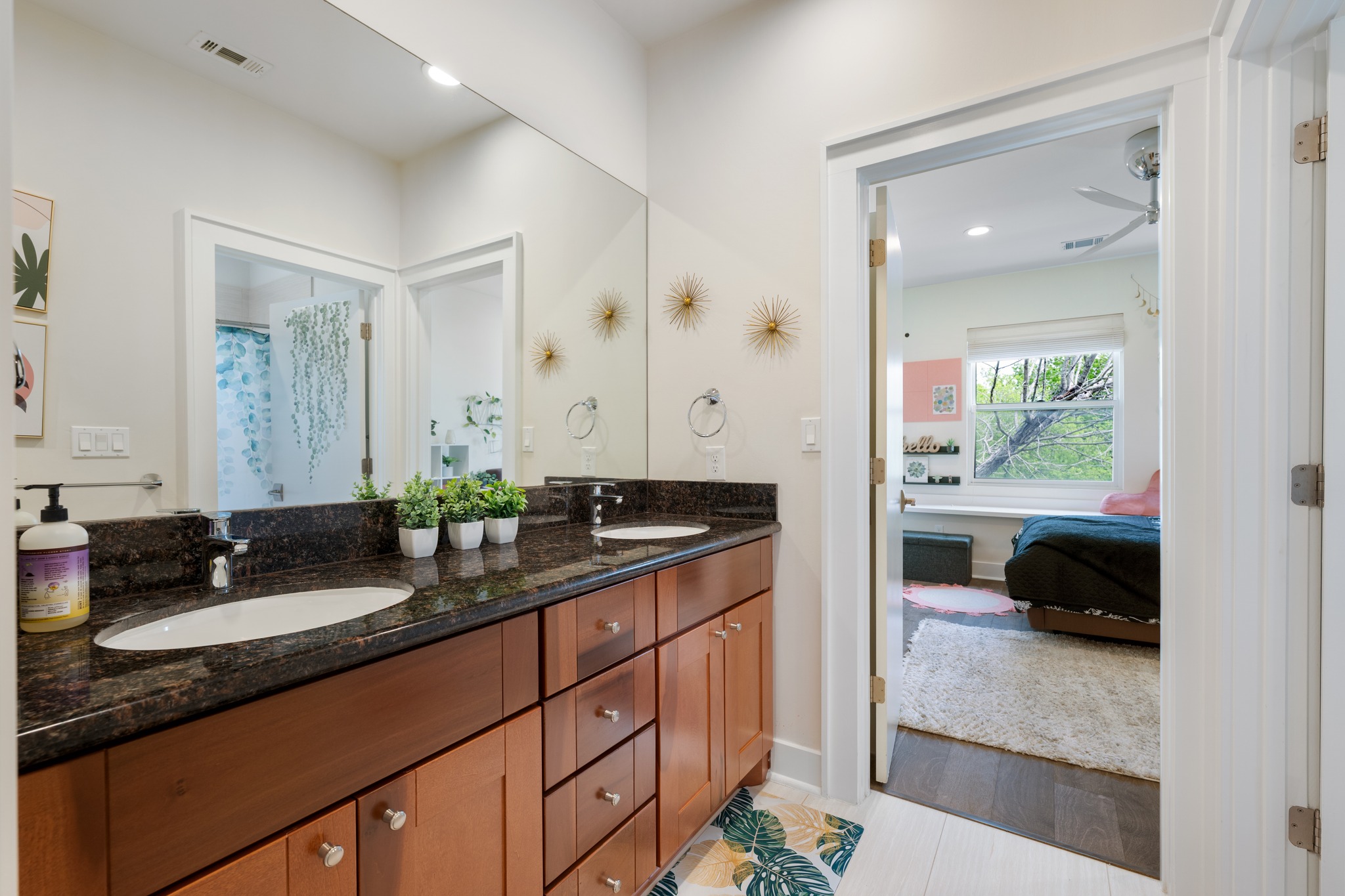 4904 Duval Street, Unit A Austin, TX 78751 - Photo 30 of 39 a en suite bathroom with double sink and a mirror