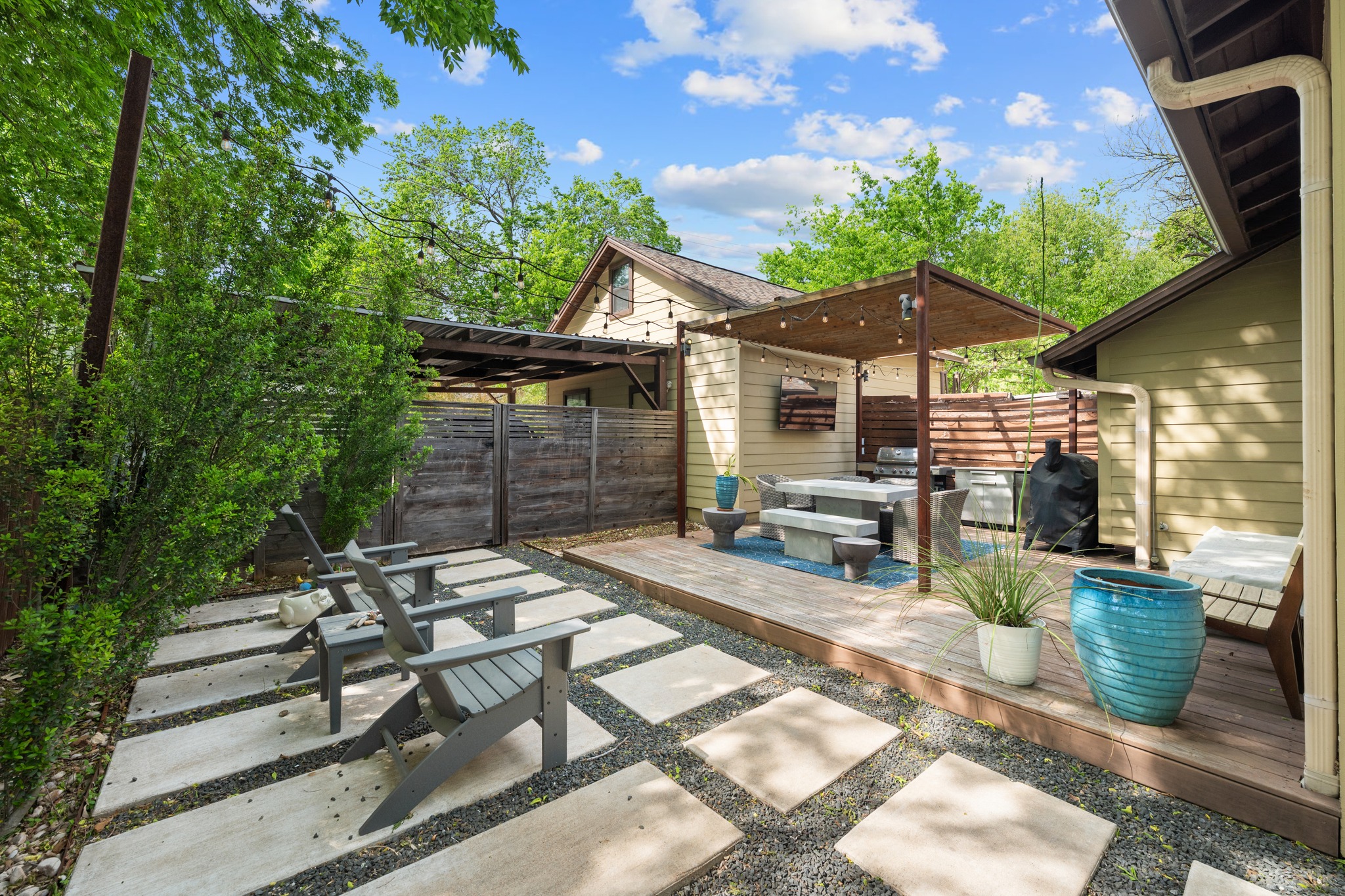 4904 Duval Street, Unit A Austin, TX 78751 - Photo 34 of 39 a view of a patio with table and chairs under an umbrella