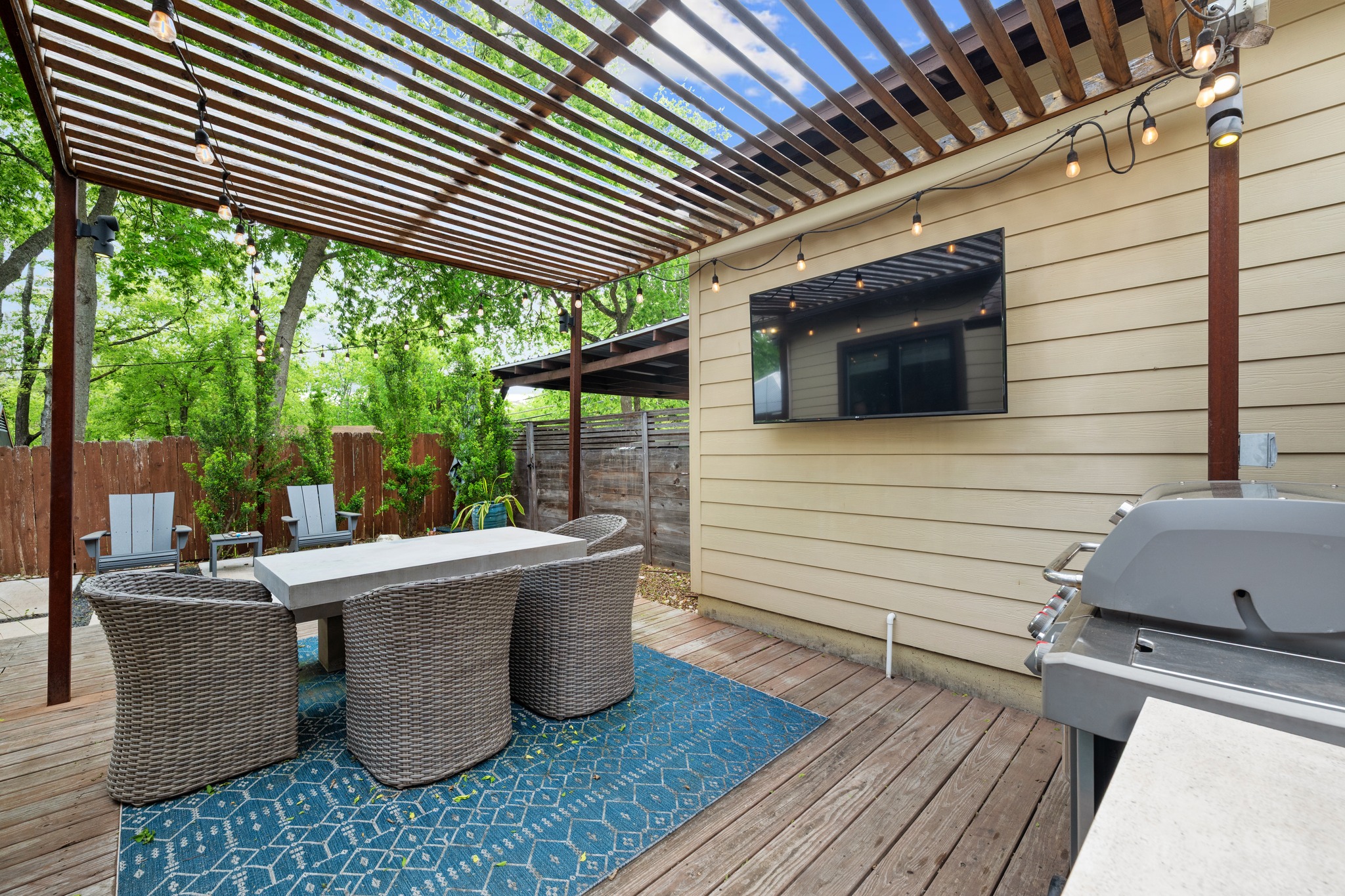 4904 Duval Street, Unit A Austin, TX 78751 - Photo 36 of 39 a view of a patio with table and chairs
