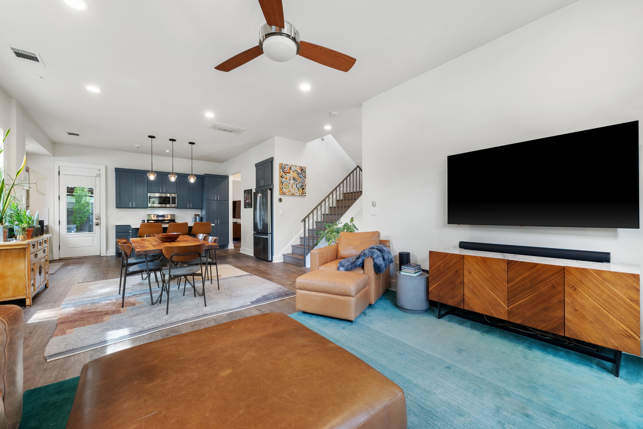 4904 Duval Street, Unit A Austin, TX 78751 - Photo 8 of 39 a living room with furniture and a flat screen tv
