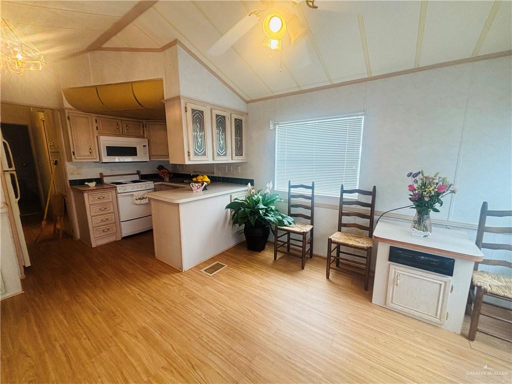 412 Sun Dial Circle Port Isabel, TX 78578 - Photo 11 of 37 a kitchen with a sink cabinets and wooden floor