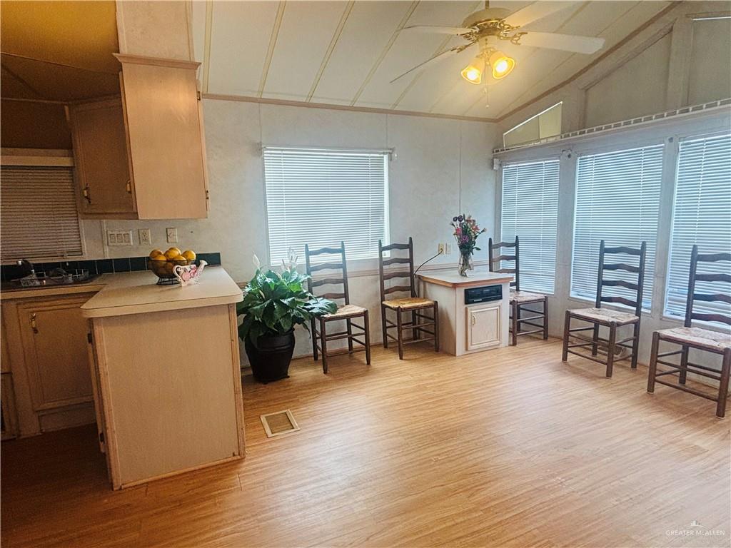 412 Sun Dial Circle Port Isabel, TX 78578 - Photo 12 of 37 a room with wooden floor and furniture