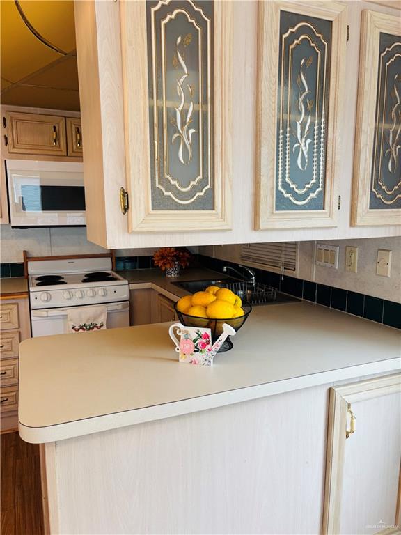 412 Sun Dial Circle Port Isabel, TX 78578 - Photo 13 of 37 a utility room with stainless steel appliances a sink and a window