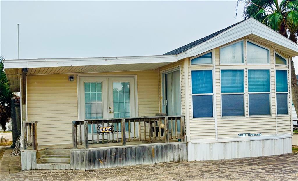 412 Sun Dial Circle Port Isabel, TX 78578 - Photo 2 of 37 a view of a house with wooden floor and a window