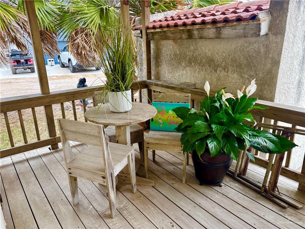 412 Sun Dial Circle Port Isabel, TX 78578 - Photo 22 of 37 a view of a balcony with chairs and a potted plant