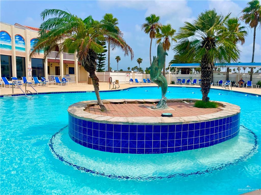 412 Sun Dial Circle Port Isabel, TX 78578 - Photo 25 of 37 a swimming pool with outdoor seating and yard