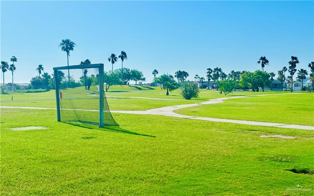 412 Sun Dial Circle Port Isabel, TX 78578 - Photo 28 of 37 a view of a golf course with a lake view