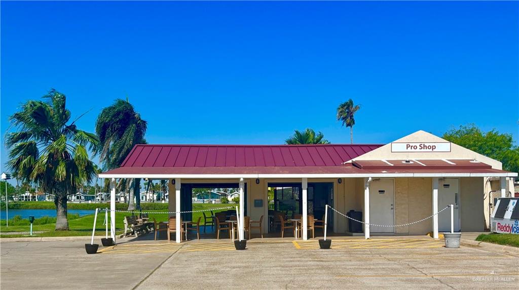 412 Sun Dial Circle Port Isabel, TX 78578 - Photo 29 of 37 front view of a house with a garden