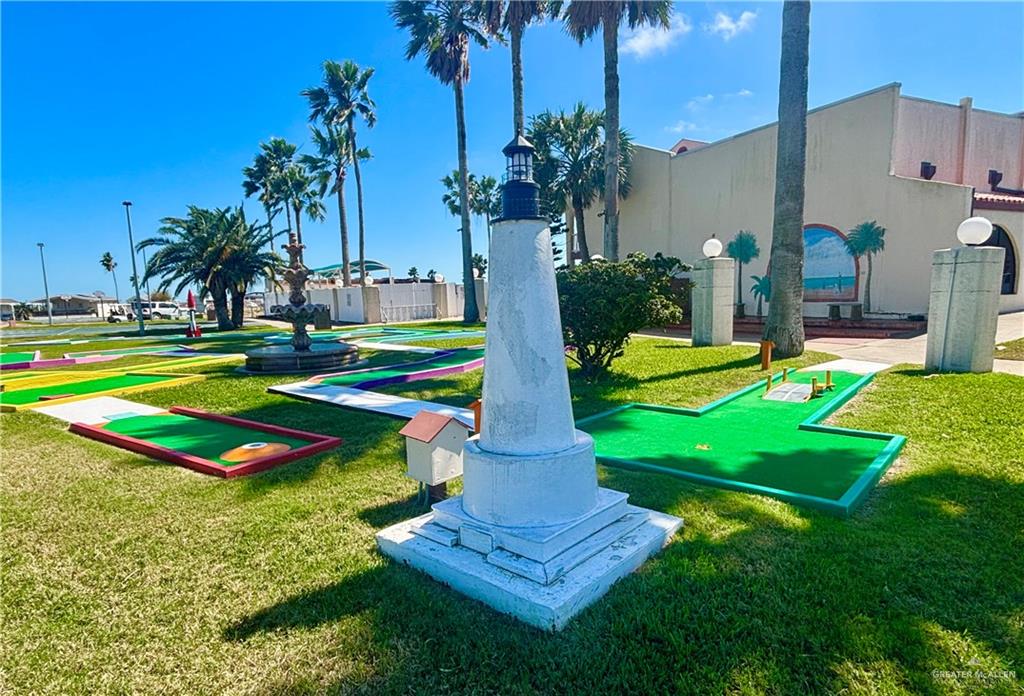 412 Sun Dial Circle Port Isabel, TX 78578 - Photo 36 of 37 a front view of a house with swimming pool and yard