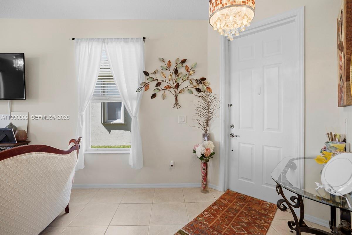 337 Southwest Maclay Way Port St. Lucie, FL 34986 - Photo 21 of 44 a view of a bedroom with natural light and wooden floor