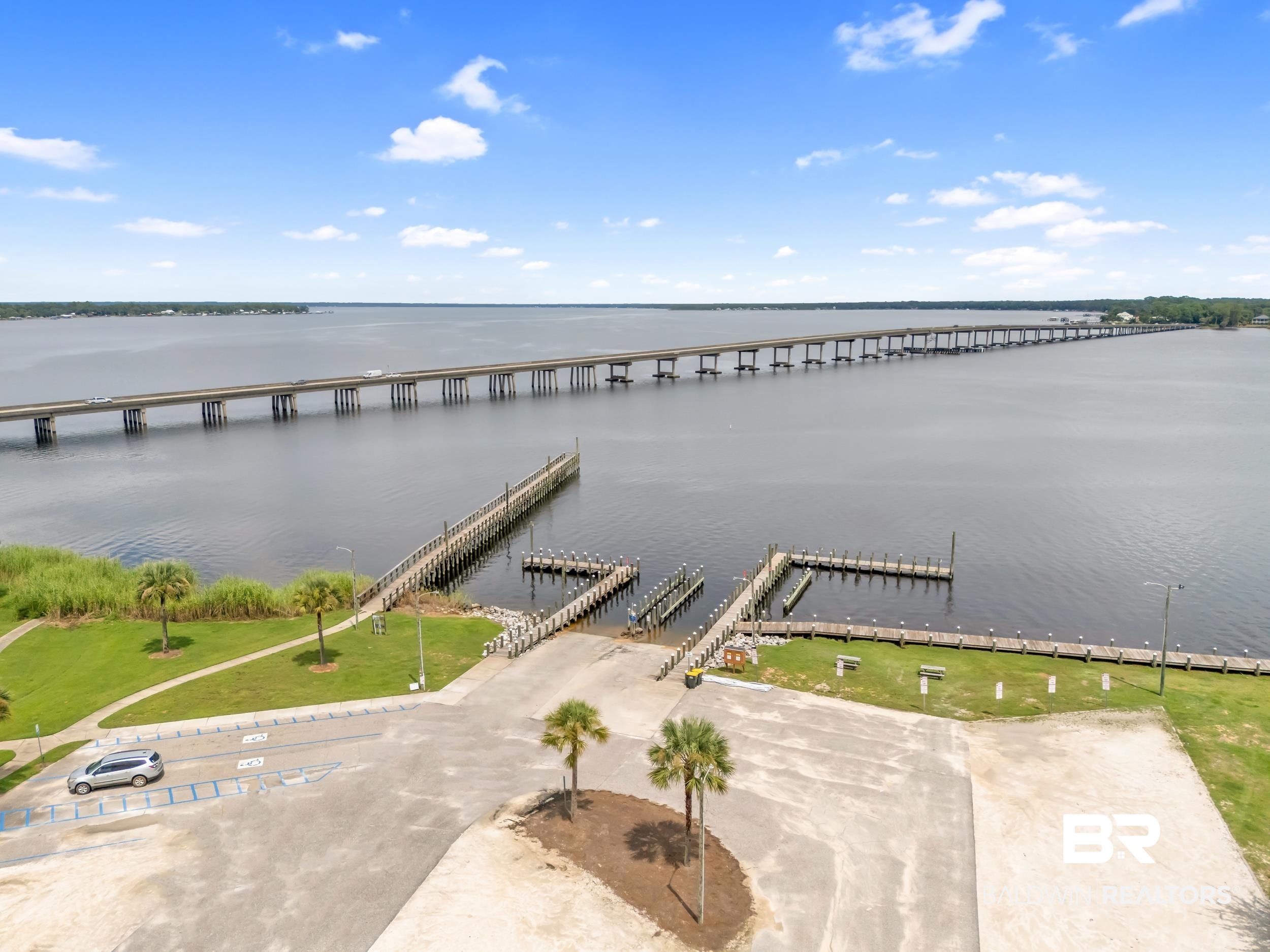 182 Defuniak Loop Lillian, AL 36549 - Photo 21 of 21 Bird's eye view of a nearby body of water and a pier