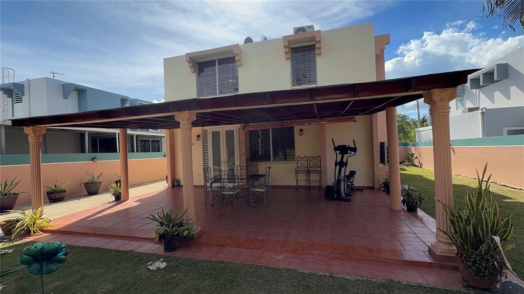 1 St Rio Grande, Unit B6 Rio Grande, PR 00745 - Photo 14 of 47 a front view of a house with patio
