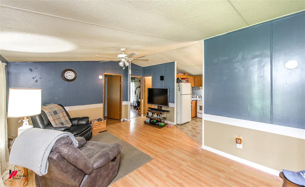 891 Pilgrim Rest Road Doyline, LA 71023 - Photo 18 of 37 a living room with furniture and a wooden floor