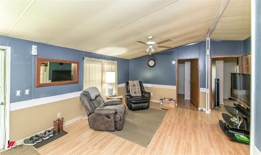 891 Pilgrim Rest Road Doyline, LA 71023 - Photo 19 of 37 a living room with furniture and a flat screen tv