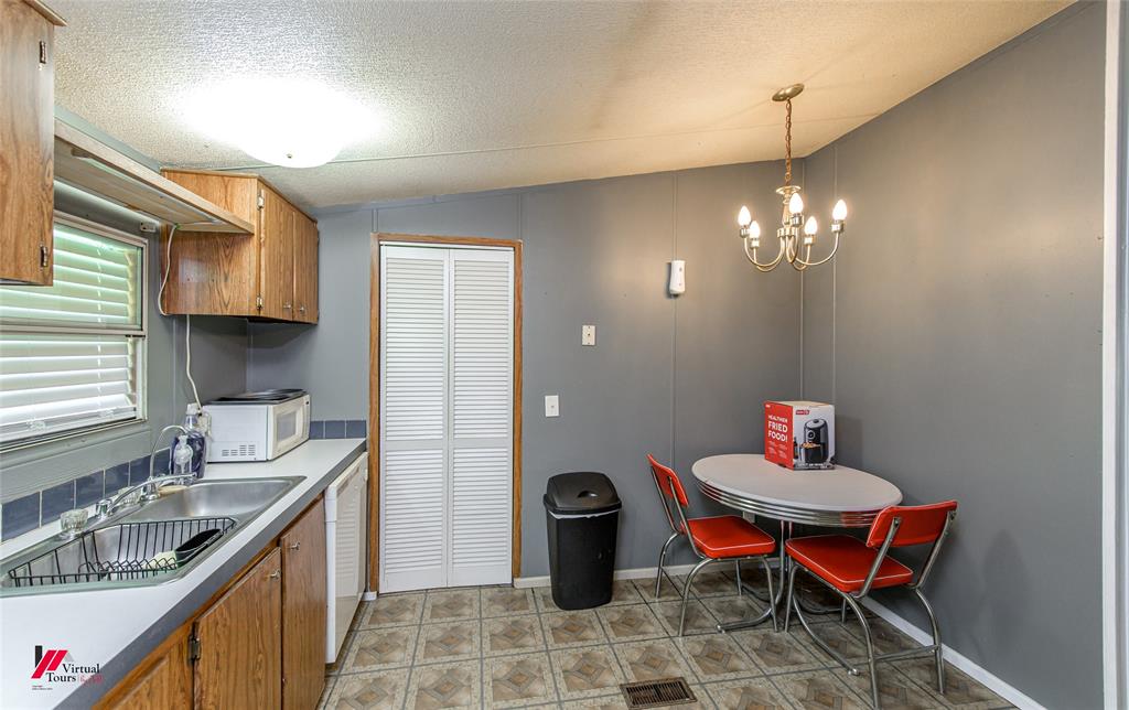 891 Pilgrim Rest Road Doyline, LA 71023 - Photo 22 of 37 a kitchen with a sink and stove