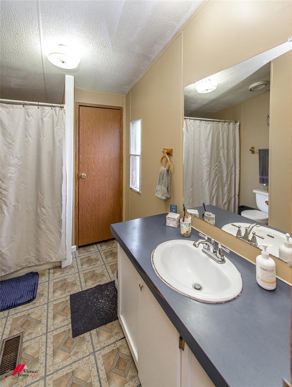 891 Pilgrim Rest Road Doyline, LA 71023 - Photo 24 of 37 a bathroom with a sink and a mirror