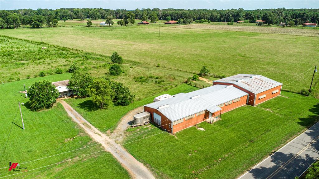 891 Pilgrim Rest Road Doyline, LA 71023 - Photo 3 of 37 a view of a lake with a yard