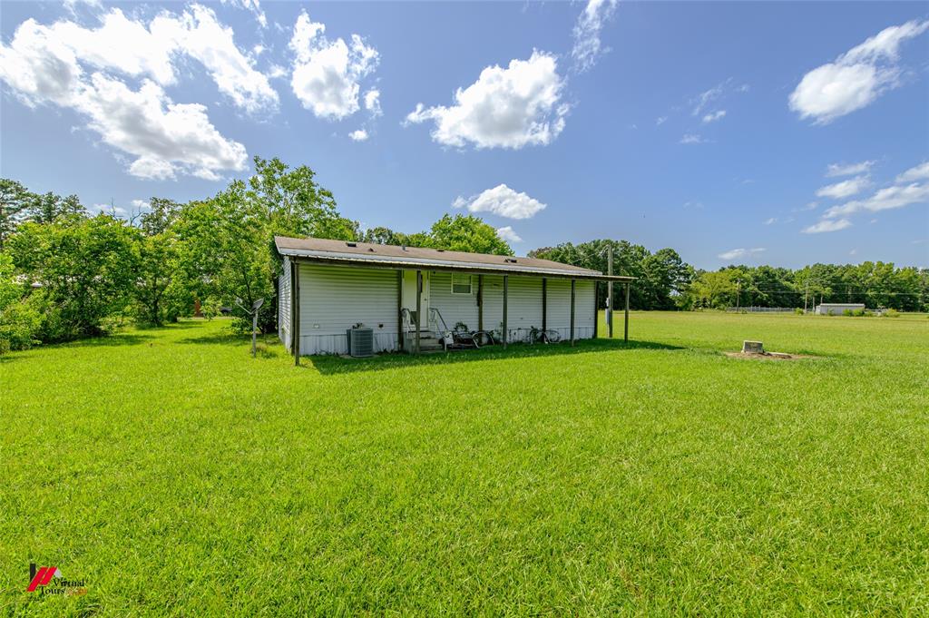 891 Pilgrim Rest Road Doyline, LA 71023 - Photo 35 of 37 a view of a house with a yard and garden