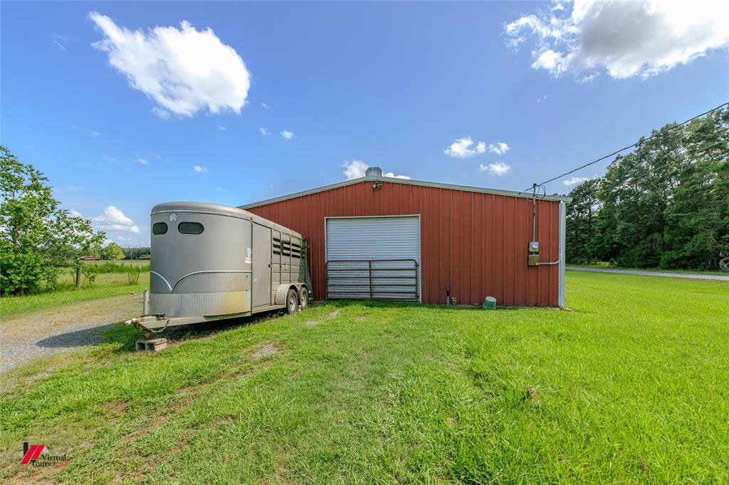 891 Pilgrim Rest Road Doyline, LA 71023 - Photo 6 of 37 a view of a backyard with a garden and entertaining space