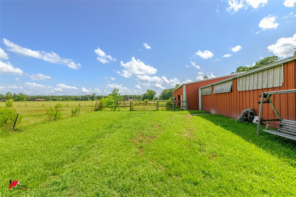 891 Pilgrim Rest Road Doyline, LA 71023 - Photo 7 of 37 a view of a house with a swimming pool and a yard
