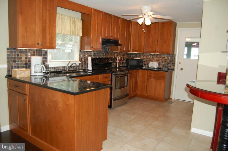 6140 Twin Point Cove Road Cambridge, MD 21613 - Photo 18 of 30 Renovated kitchen with stainless steel appliances