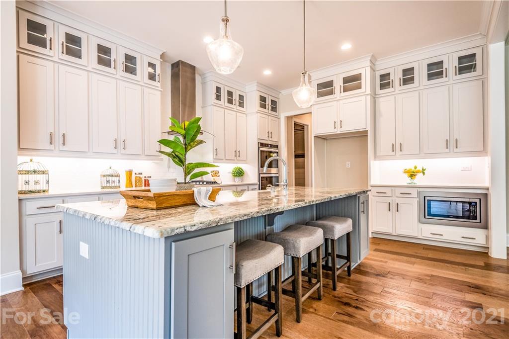 318 Grassy Rdg Court Clover, SC 29710 - Photo 2 of 31 a kitchen with stainless steel appliances granite countertop a table chairs sink and cabinets