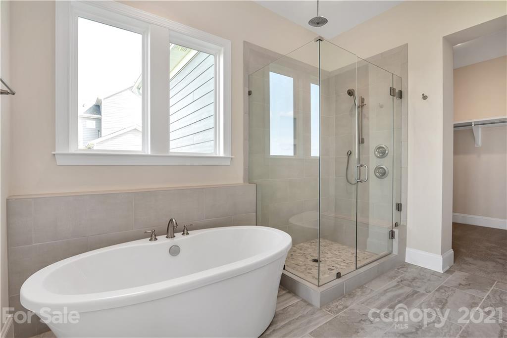 318 Grassy Rdg Court Clover, SC 29710 - Photo 16 of 31 a white bath tub sitting next to a shower