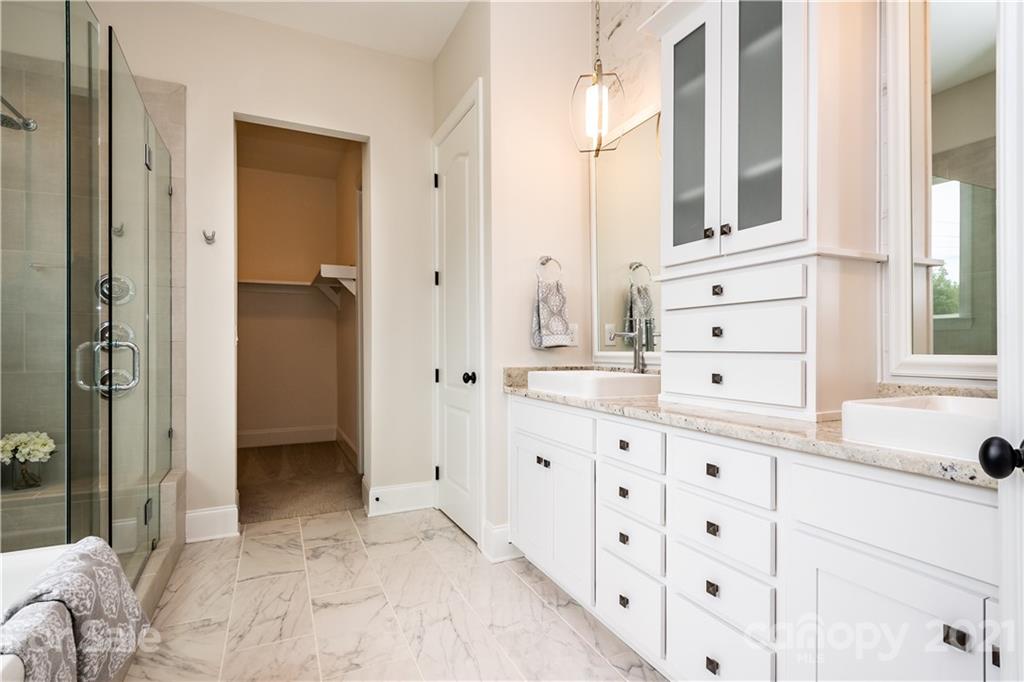 318 Grassy Rdg Court Clover, SC 29710 - Photo 19 of 31 a bathroom with a sink and a mirror