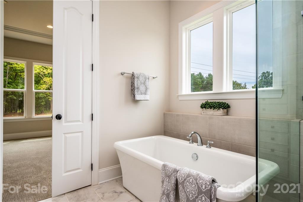 318 Grassy Rdg Court Clover, SC 29710 - Photo 20 of 31 a bathroom with a white tub and shower