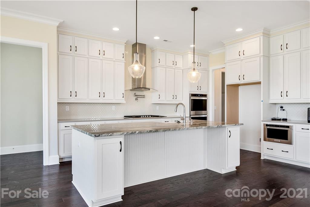 318 Grassy Rdg Court Clover, SC 29710 - Photo 7 of 31 a kitchen with stainless steel appliances granite countertop a stove a sink and a refrigerator