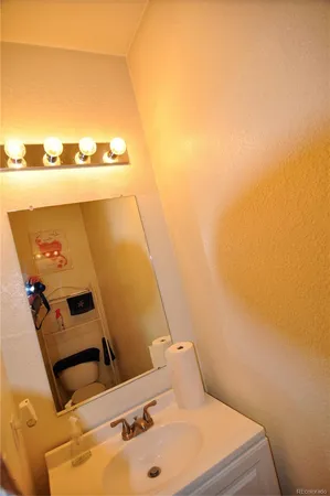 a bathroom with a sink and mirror