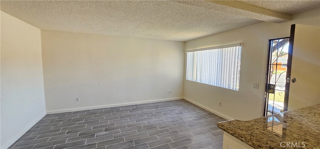 4211 Mountain Drive, Unit 2 San Bernardino, CA 92407 - Photo 3 of 11 a view of an empty room with window