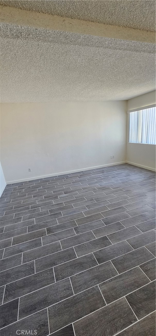 4211 Mountain Drive, Unit 2 San Bernardino, CA 92407 - Photo 10 of 11 a view of an empty room and window