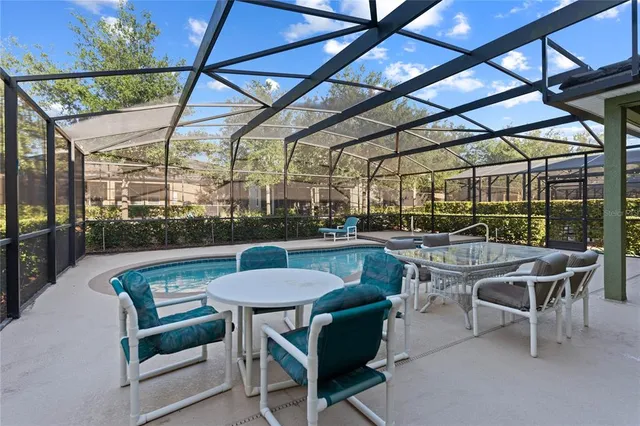 a bathroom with a granite countertop sink and a bathtub