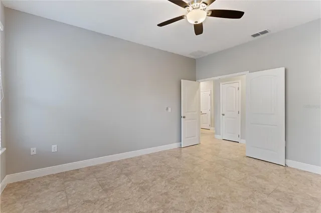 a bathroom with a granite countertop sink a large mirror and vanity