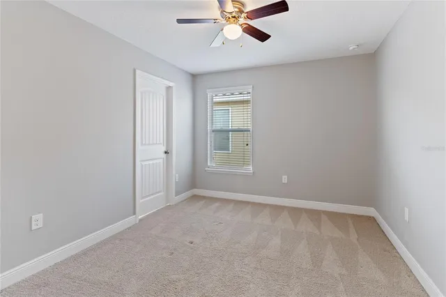 a bathroom with a granite countertop sink a mirror and a shower