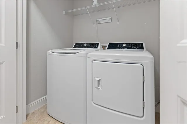 an aerial view of residential houses with city view