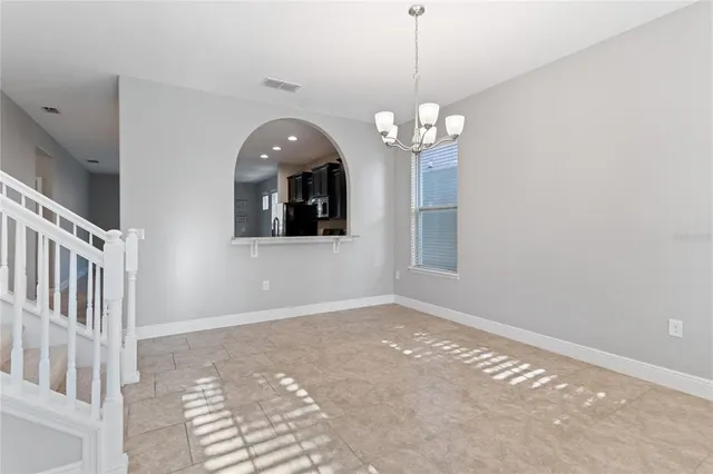 a view of a hallway with entryway wooden floor and stair